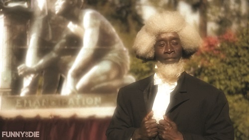 Don Cheadle as Frederick Douglass offers wry (or is it rye?) commentary on the “Great Emancipator.”