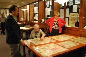 John Nelson shows a donor the Stuckenberg Map Collection in Gettysburg College’s Special Collections.