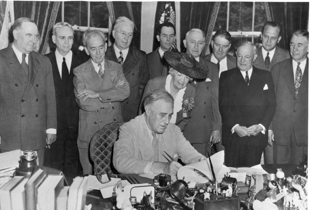 President Roosevelt signs the Servicemen's Readjustment Act of 1944, or the GI Bill. 